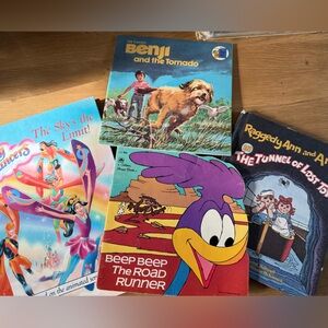 Variety of vintage children’s books, Raggedy Ann, Benji, roadrunner, sky dancers